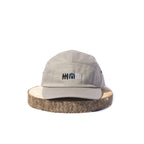 Grey BORA cap with embroidered front logo, front view on a wooden display stand