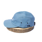 Blue BORA cap, side view showing ventilation eyelets and embroidered BORA logo