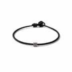 Black BORA cord bracelet with a central logo bead and adjustable sliding knot