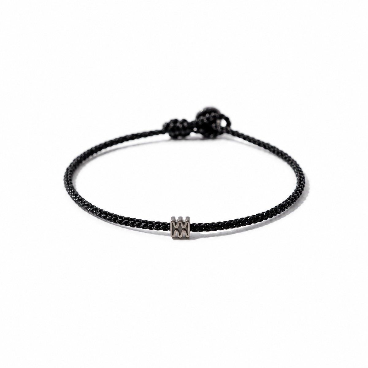 Black BORA cord bracelet with a central logo bead and adjustable sliding knot