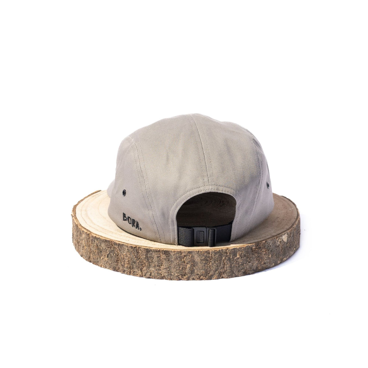 Grey BORA cap, rear view showing the adjustable black strap and buckle